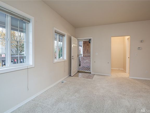 A view of the entry, and the adjacent convenient half bath.