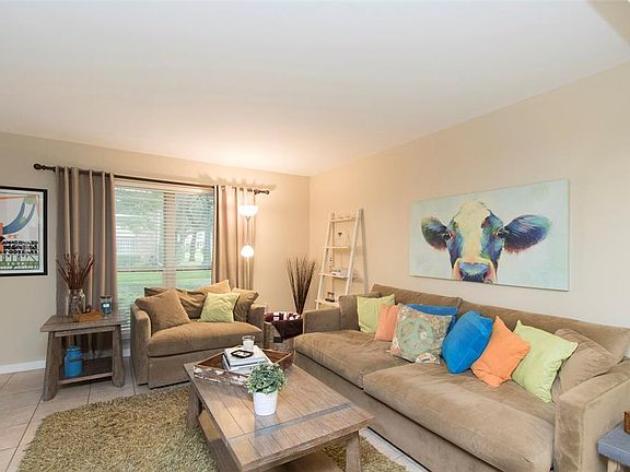 Another view of the comfortable living area with a large window and ample space for enjoying quiet time alone or fun activities with friends and family.