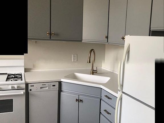Kitchen with newer countertops and dishwasher.
