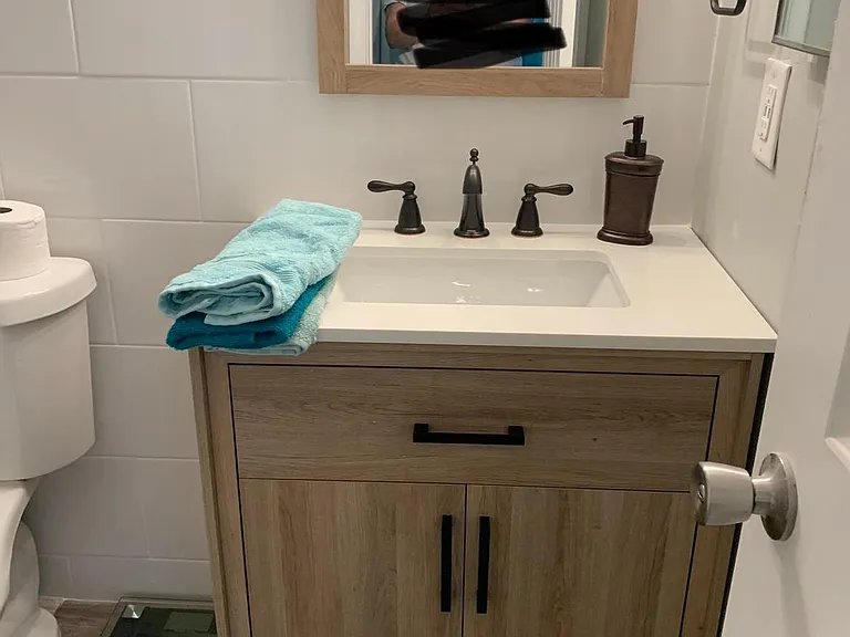 Early 2022 new bathroom-new floors, cabinets, shower tile, fixtures, lights