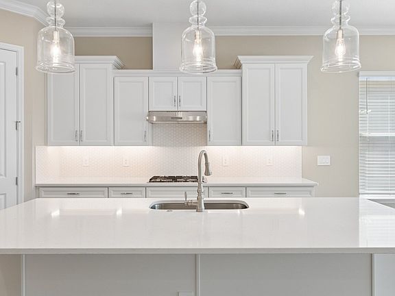 Kitchen with spacious white quartz island