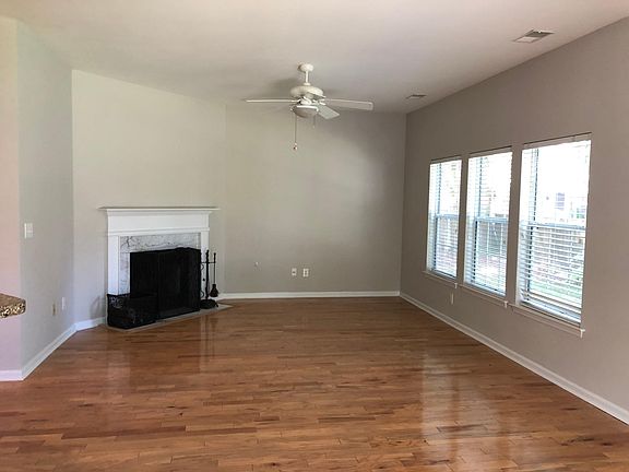 Living room and wood burning fire place.