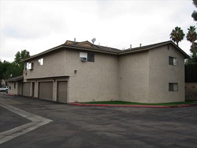 Back of building by parking