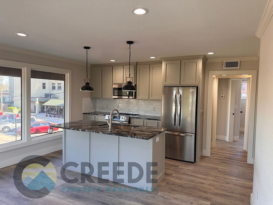 Granite countertops and marble backsplash.