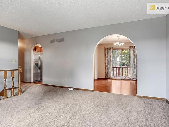View of Living Room into Dining Room and Kitchen