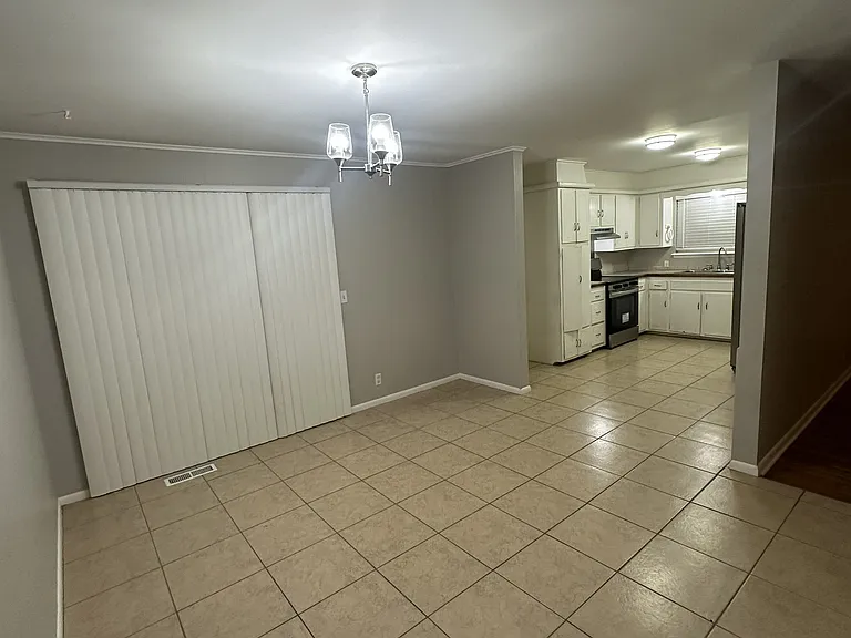 Dining Area with Patio Door, Newer Lighting and Paint