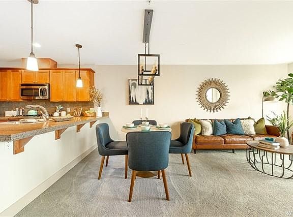 Kitchen counter, dining area and living room