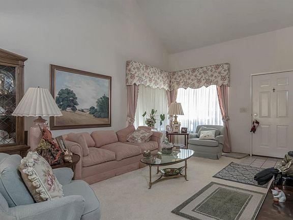 Living room with vaulted ceiling.