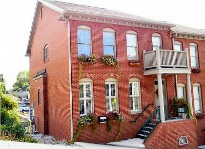 1st image of 106 E 1st St