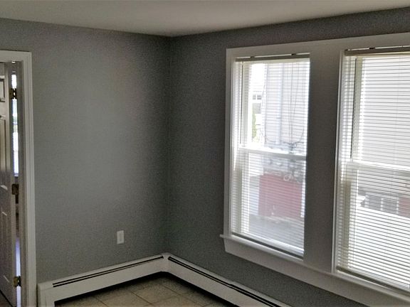 Eat-in Kitchen - sunny with lots of windows and light, solid wood white cabinets, granite countertops, ceramic tiled floor, all appliances
