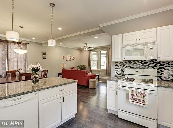 Kitchen looking into the dining area and living room
