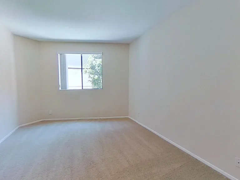 Primary bedroom of apartment #213