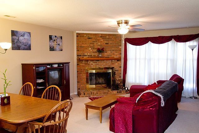 wood-burning fireplace in spacious living room