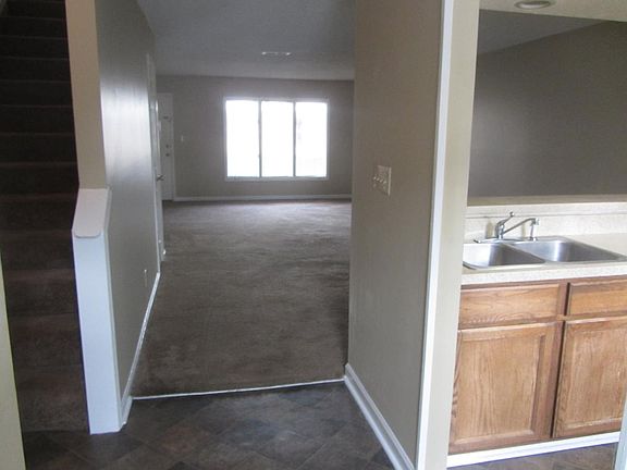 Hall entering house, next to half bath