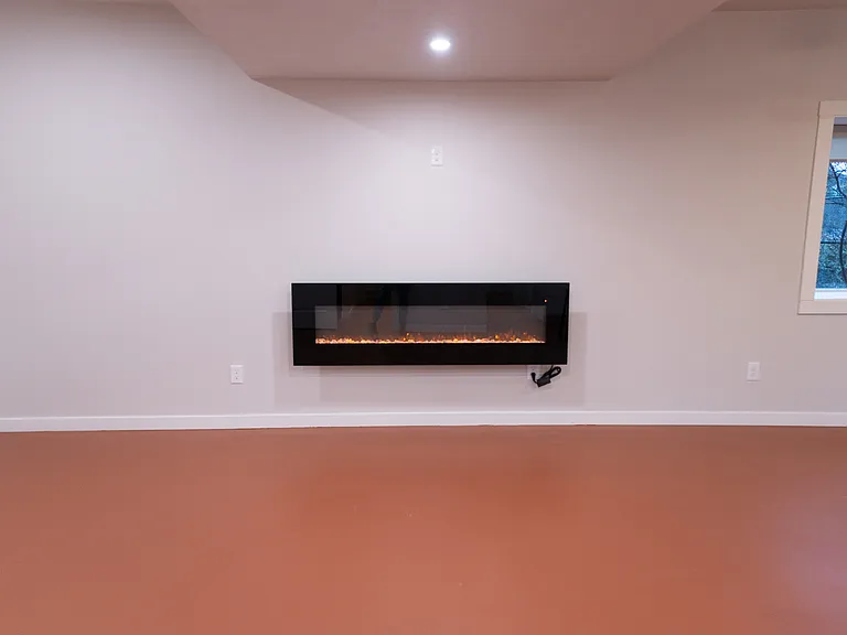 Electric fireplace with a TV plug above