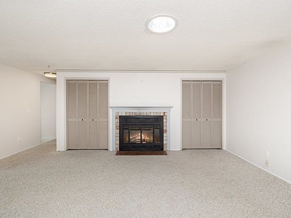 Living room with Double Storage and Fireplace