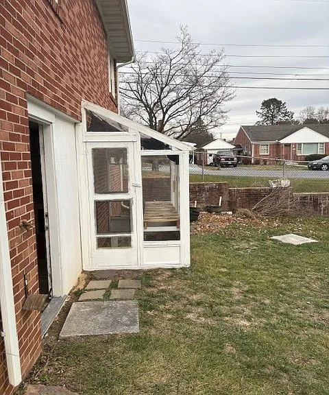 Walk out From Workshop to rear yard with greenhouse