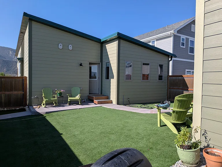 Fenced backyard w turf