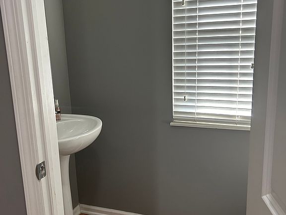 Half bath in hallway from kitchen