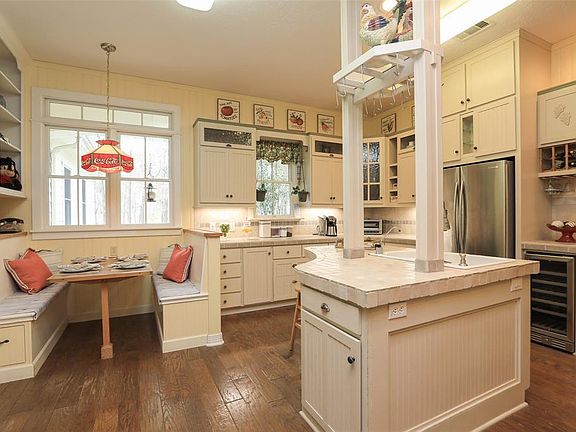 Built in breakfast booth! Tons of cabinets and storage! Wine cooler, pots and pans drawers and more!