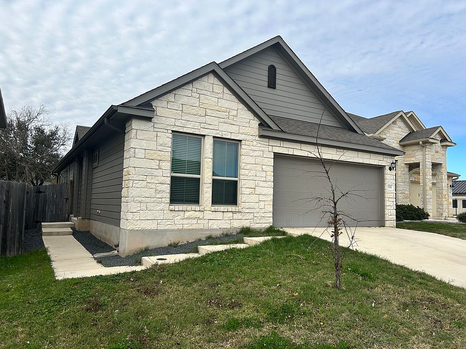 Front view with 2 car garage