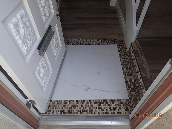 Custom marble and decorative glass tile entry landing