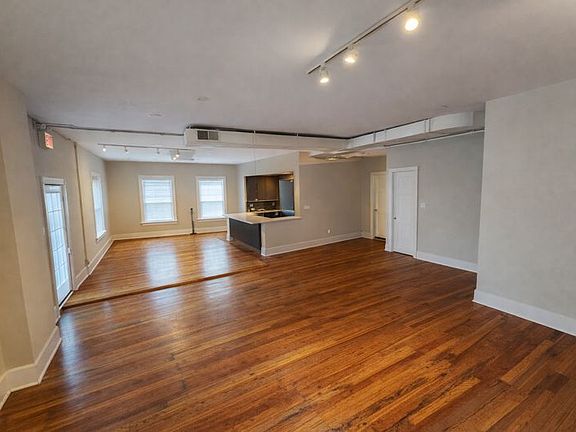 Open Living Area looking into dining/kitchen

Photos include virtual removal of furniture to better show room layout.