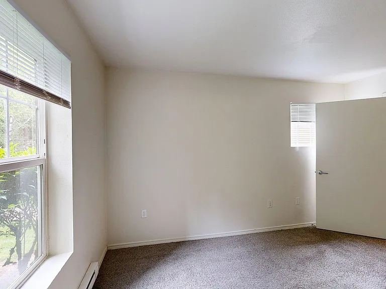 Spacious apartment Bedroom with Carpet Floor.