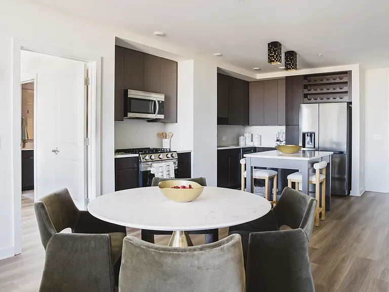 Cook in style with gourmet kitchens, single basin sinks and sleek tile backsplash.
