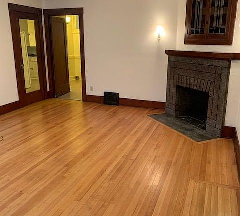 Living room with hardwood floors and decorator fireplace