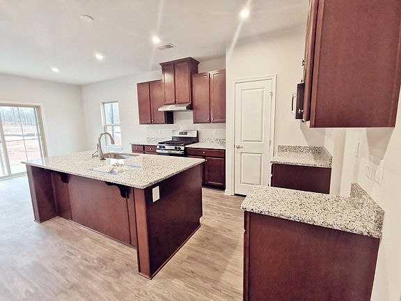 Open Kitchen with SS appliances and granite countertops