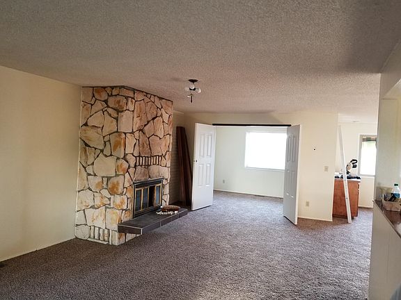 Living Room looking toward 3rd bedroom (double doors) & form