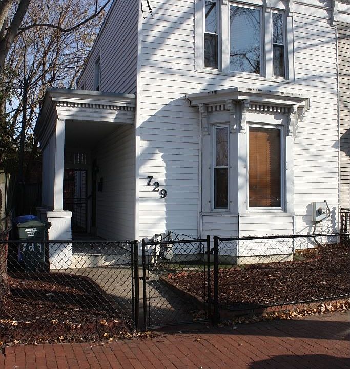 Front of house w/porch/fence
