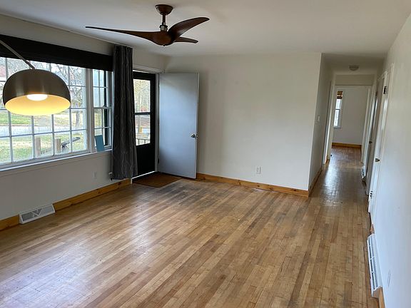 Living room, view from kitchen. Front door shown.