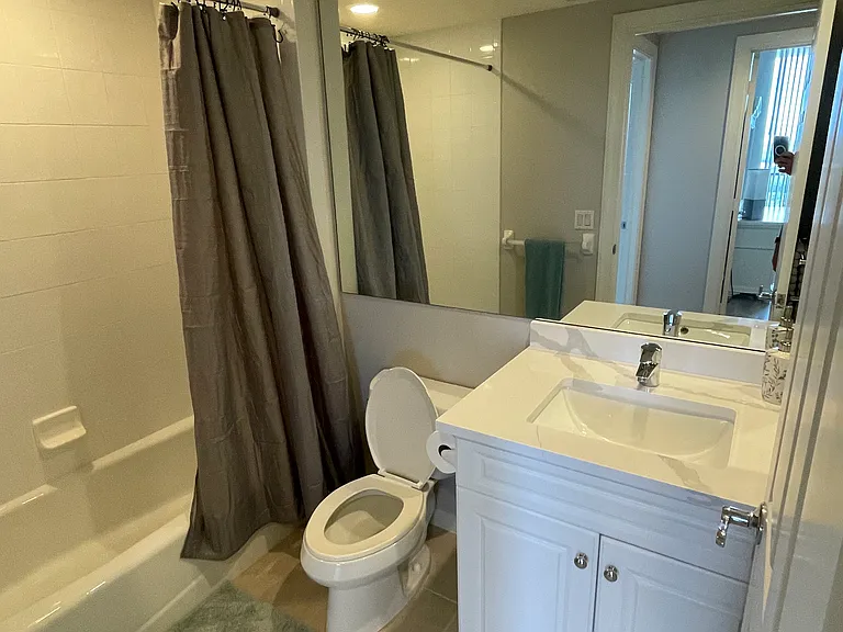 Full bath outside the 2 guest bedrooms