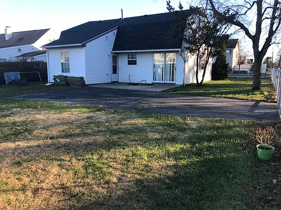 Back of house with driveway