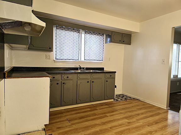We updated the Kitchen and updated and new updated paint color. These photos don't do it any justice. 
Nice size kitchen, you can't see the full size here. Refrigerator would go to the right of the cabinets and the stove to the left under the hood vent