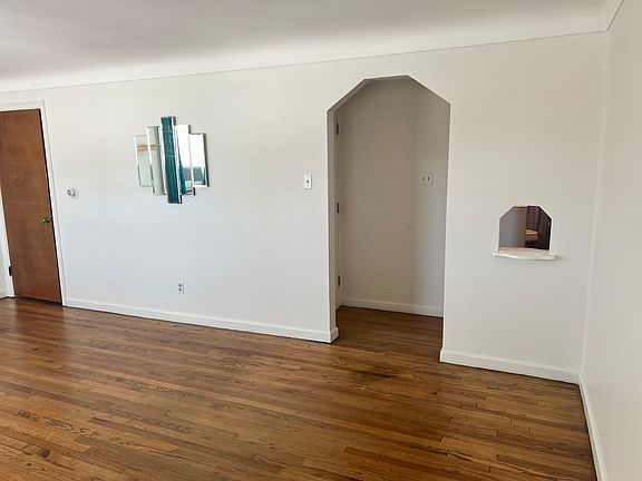 living room view into entrance and closet door