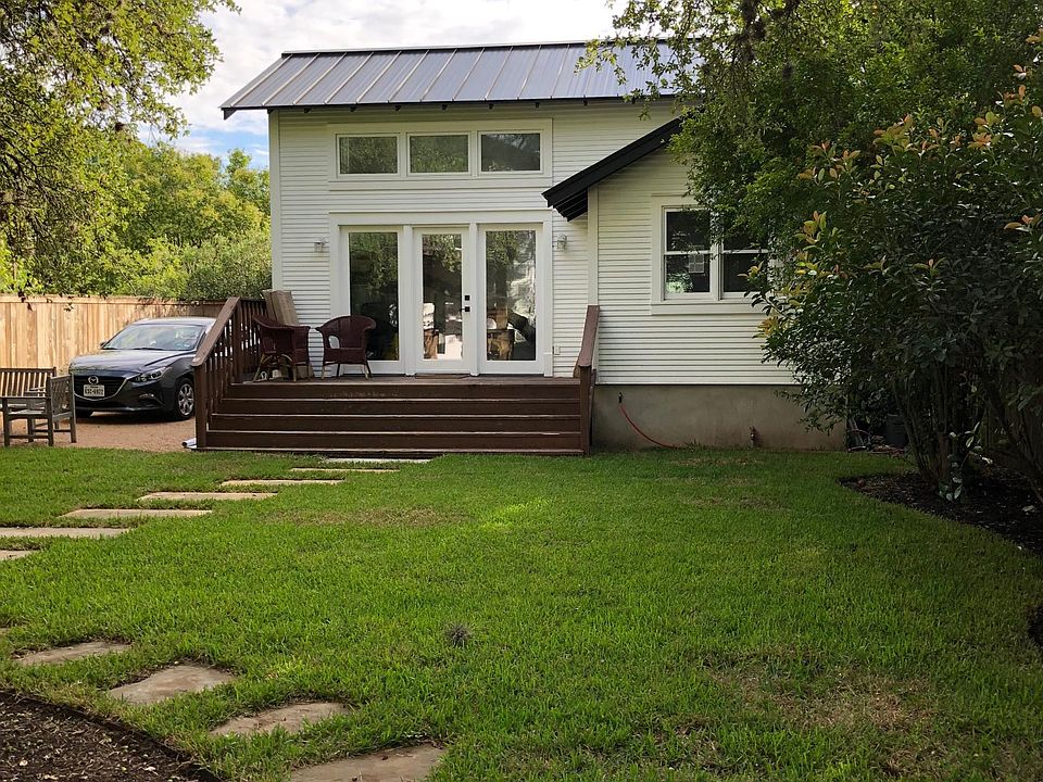 Outside of house. Currently there is a privacy fence between the front and back house (not pictured here).