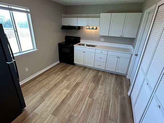 Kitchen - new cabinets, quartz countertops, appliances and all new floor and paint!
washer and dryer hookup located behind closet doors