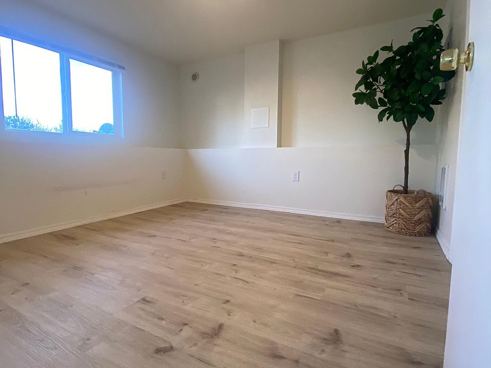 Bright bedroom with brand-new Mohawk luxury vinyl flooring