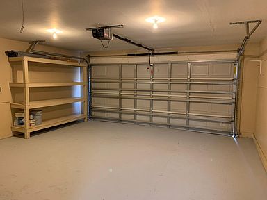 1.5 car garage with storage shelves