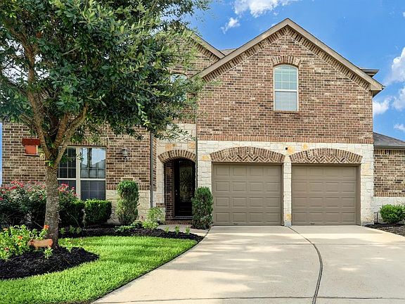 Stone and brick with double driveway and 2.5 garage