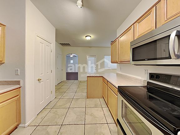 5th image of 15954 W Port Royale Ln