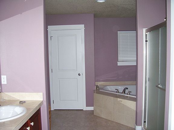 master bath with large corner soaking tub