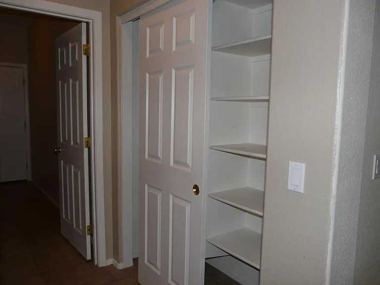 storage closet
walkway to laundry and garage