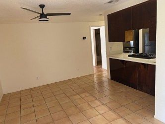 Large dining room with breakfast bar tile floors