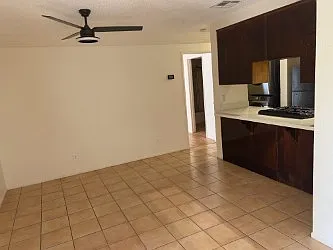 Large dining room with breakfast bar tile floors
