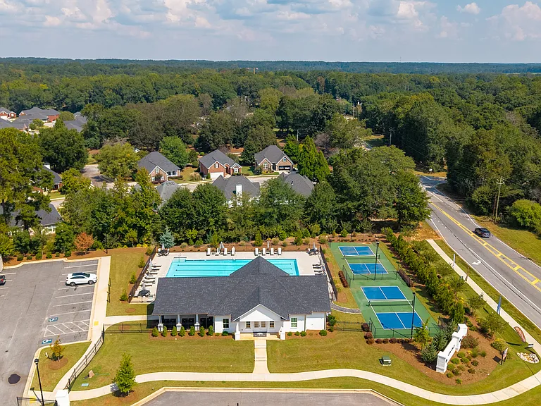 Bird's-eye view showcasing the clubhouse and surrounding amenities.