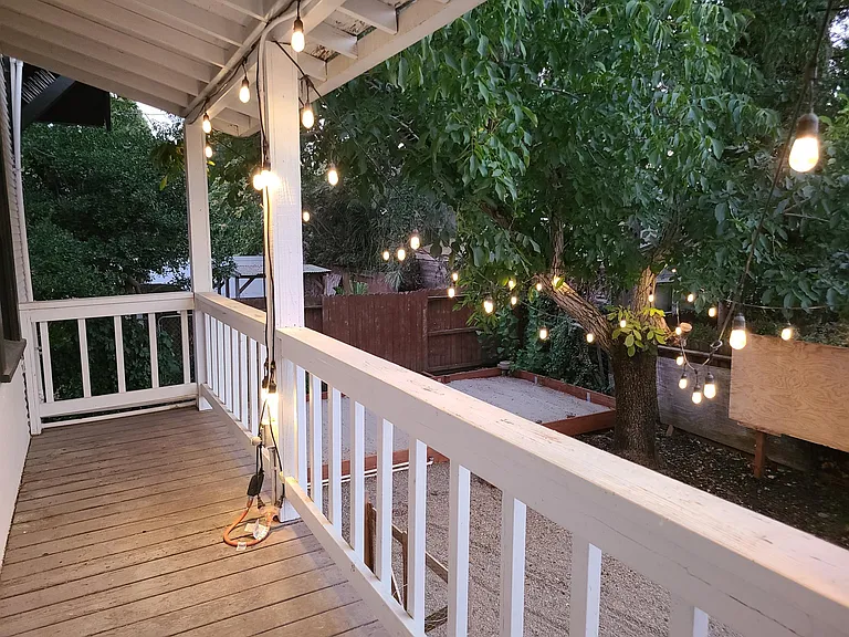 Sizeable back yard with two vegetable garden beds and fruit trees: Orange, Cherry, Plum, Peach, Fig, Lemon, and Walnut for your enjoyment.